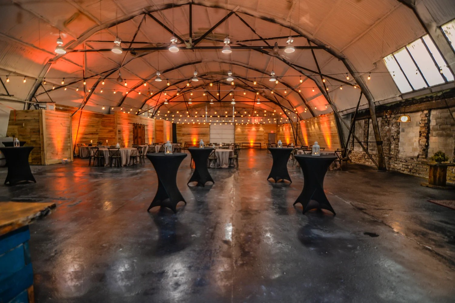 The arched event hall at 1010 West Church Street under amber light.