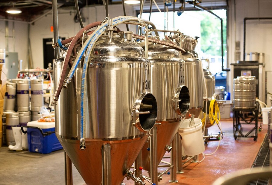 Fermentation tanks on the brewing floor at 1012 West Church.