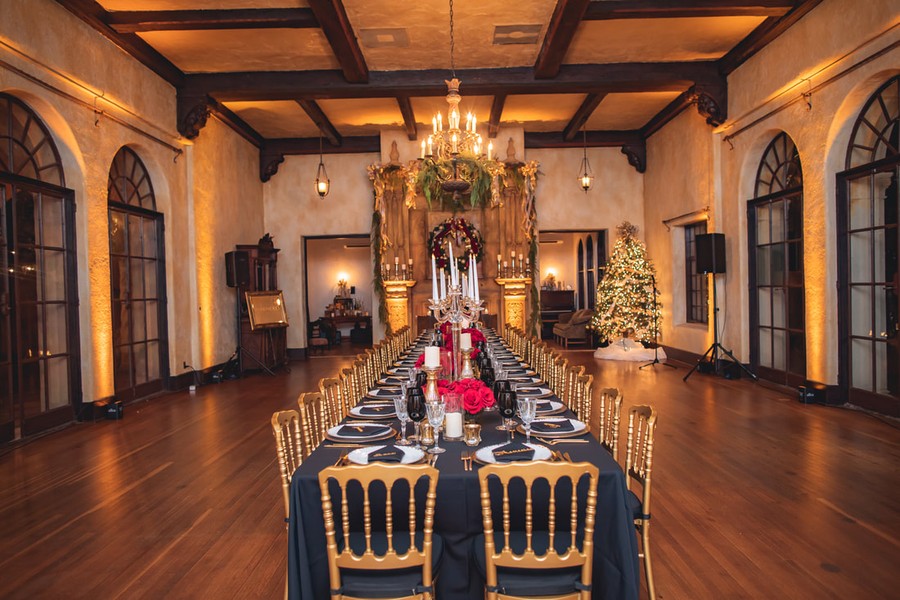 A candlelit table in the beamed hall at the Howey Mansion.