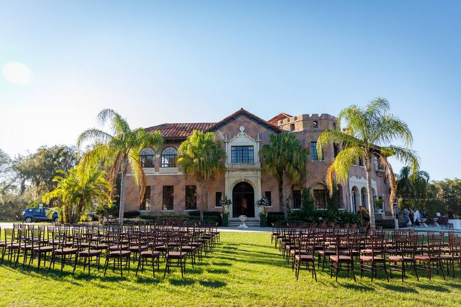A wedding ceremony on the front lawn of the Howey Mansion.