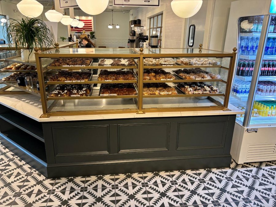 The brass doughnut case at Parlor Doughnuts in Orlando.