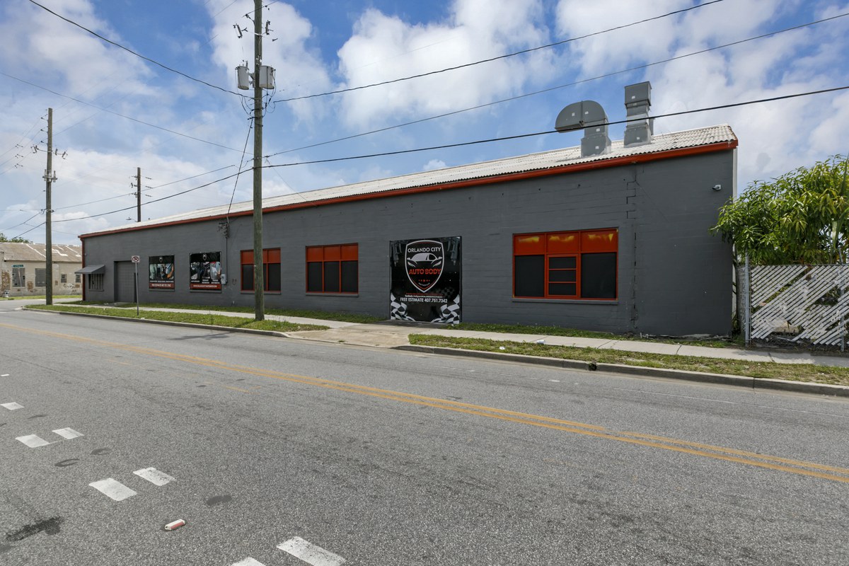 The long masonry elevation running down West Pine Street.