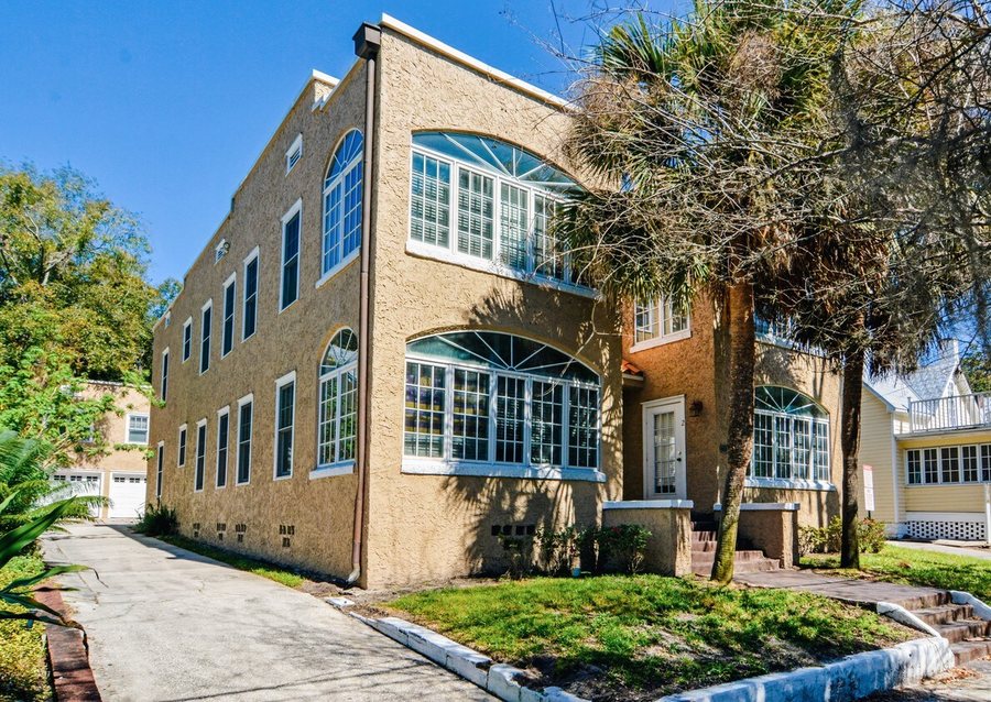 The 1920s stucco building at Thornton Park with its arched windows.