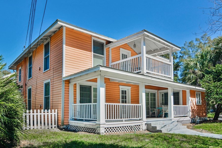 A restored frame house with wraparound porches at Thornton Park.